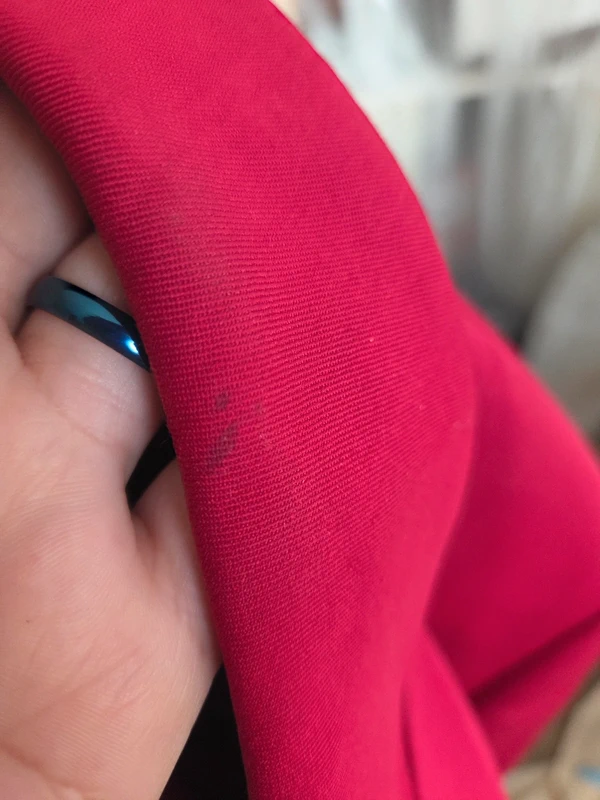 Fabric texture detail - structured red wool blend