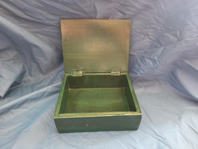 Vintage hand painted wooden apple box - open showing painted green interior and metal hinges