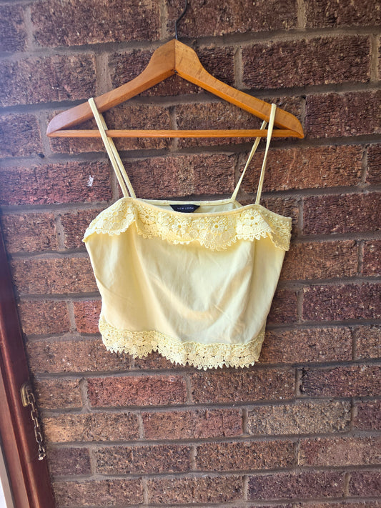New Look lemon yellow crochet lace crop cami top, front view on hanger