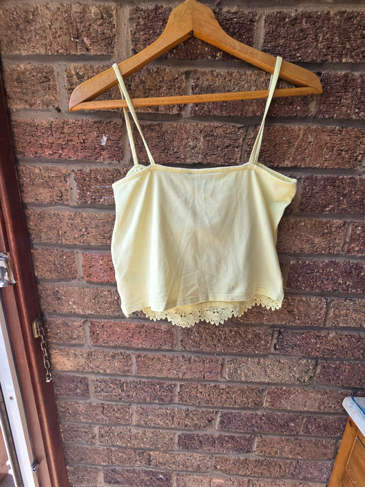 New Look lemon yellow crochet lace crop cami top, back view on hanger