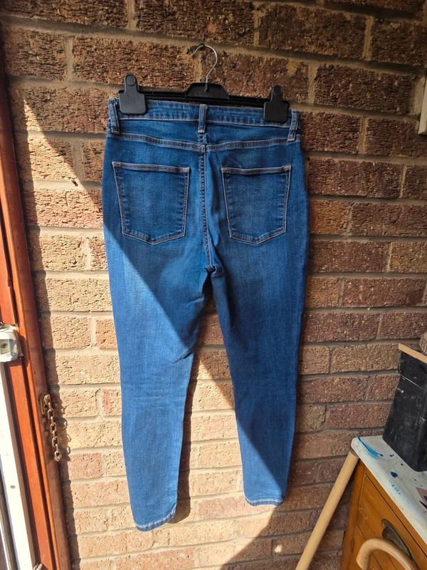 V by Very mid blue skinny jeans - back view on hanger