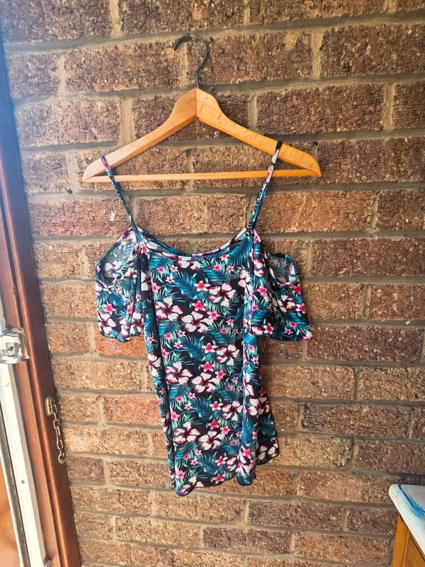 Peacocks tropical floral cold shoulder top - front view on hanger