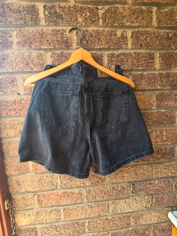 PrettyLittleThing washed black denim shorts - back view