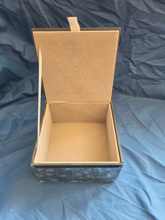 Vintage mirrored trinket box open showing felt lined interior and ribbon pull tab