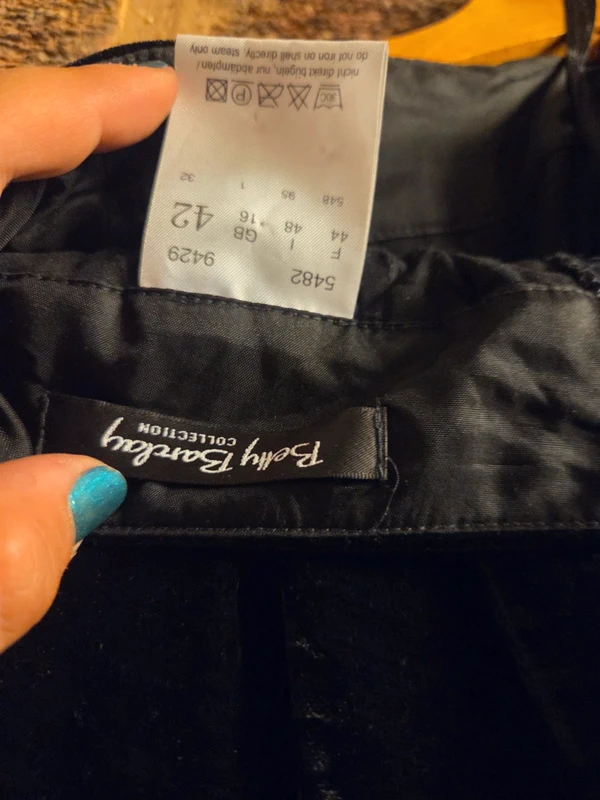 Care label - steam only, polyester velvet acetate lining