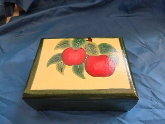 Vintage hand painted wooden apple box - closed lid showing red apple folk art on cream panel with deep green body