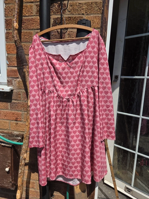 Shein pink heart print smock babydoll dress - front view showing V neckline and elasticated waist